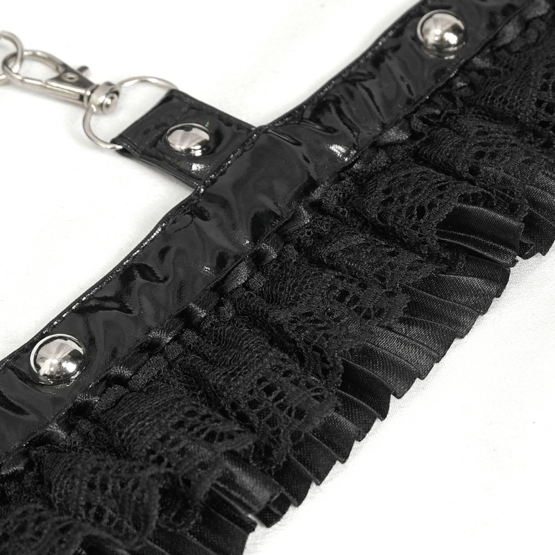 Close-up of black ruffled lace detail with snaps for women's gothic lingerie bodysuit.