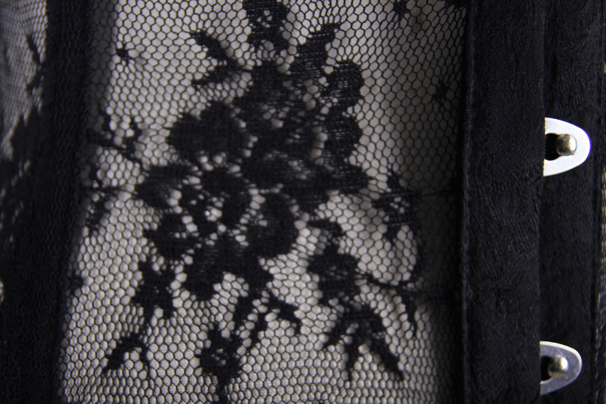 Elegant black lace fabric with floral patterns on a gothic corset.
