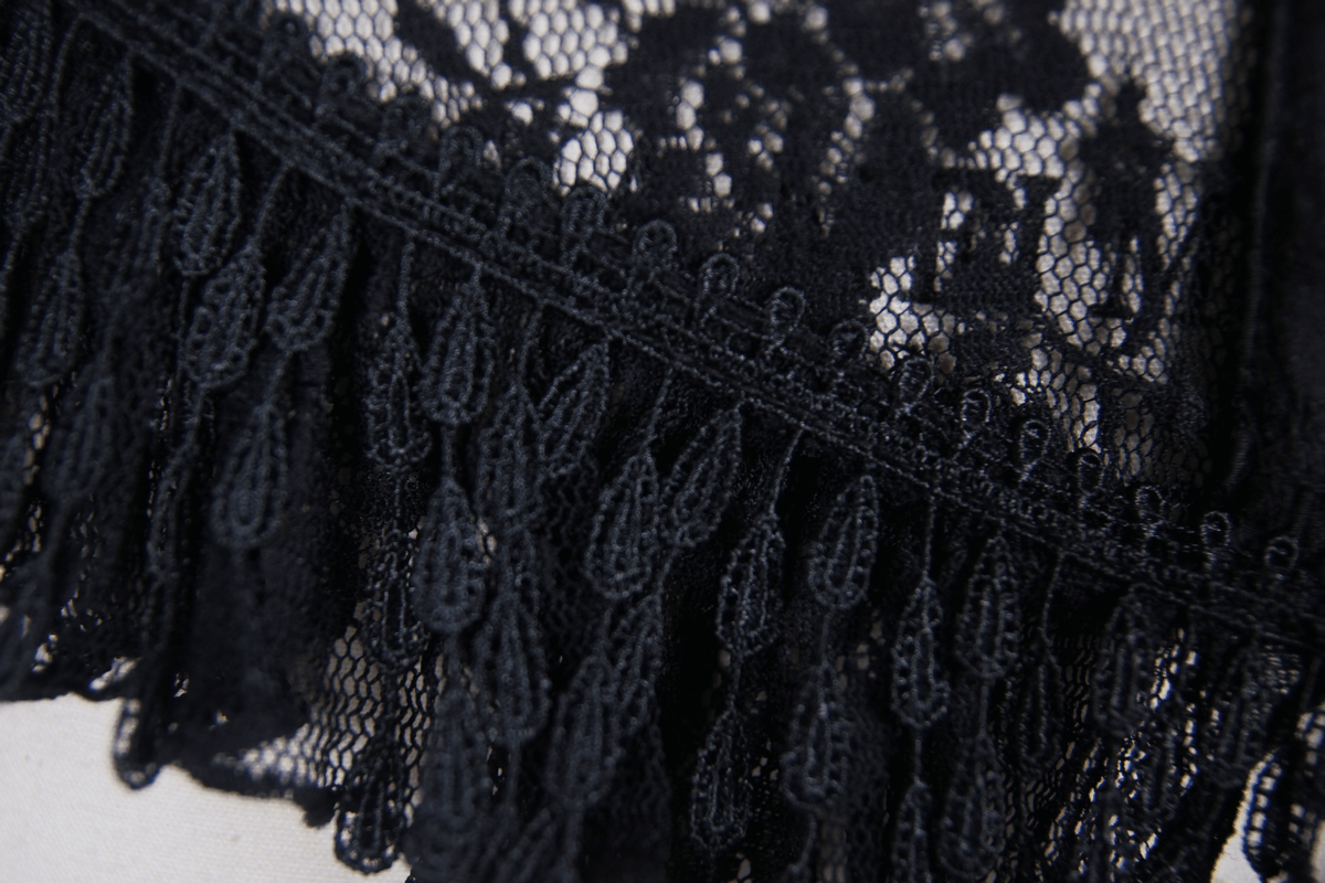 Close-up of elegant black lace with intricate patterns and fringe detailing, perfect for a gothic corset.