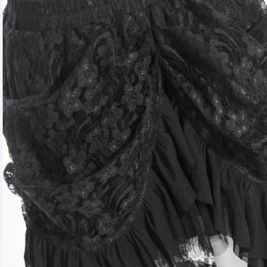 Close-up of a high-waisted women's Gothic skirt featuring lace detailing and asymmetrical ruffles in black.