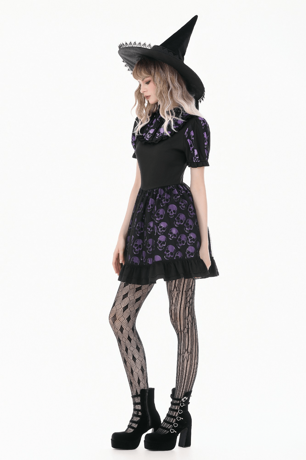 Women's Gothic Skull Print Mini Dress with Puff Sleeves styled with a witch hat and fishnet tights.