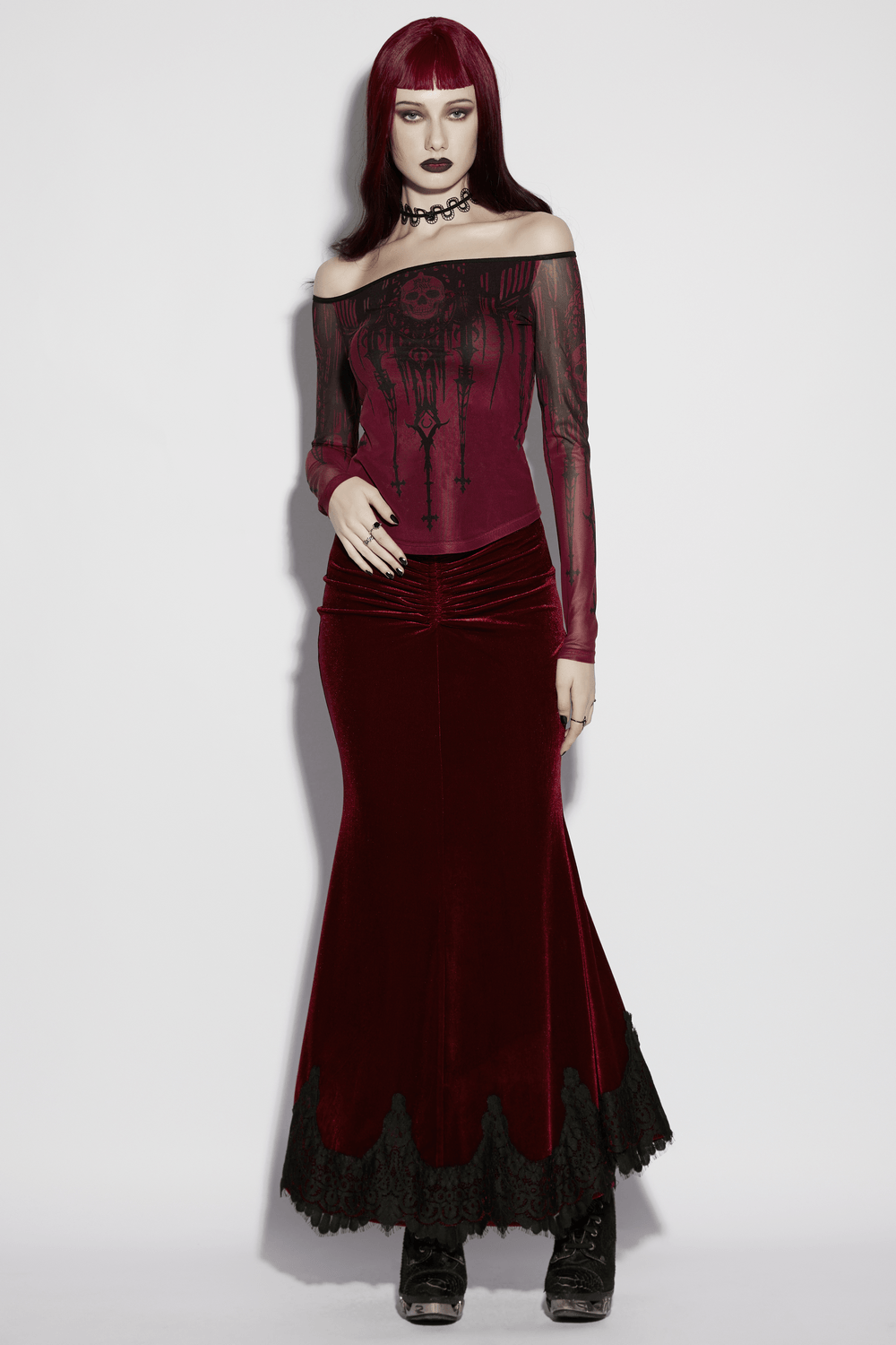 Women's Gothic Skull Print Off Shoulder Mesh Top worn with a gothic velvet skirt, featuring a striking design and dark allure.