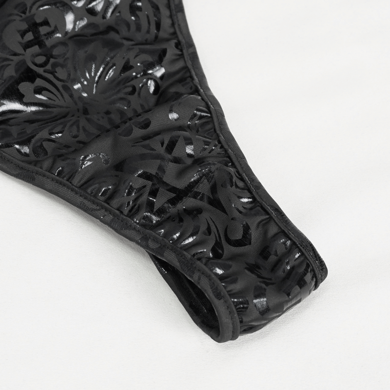 Close-up of black gothic floral printed swimsuit with intricate lace detailing and stylish strappy sides.