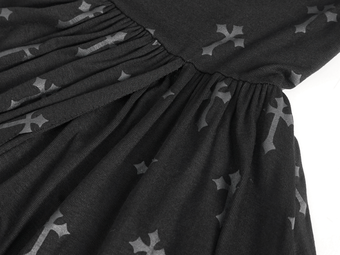 Close-up of the dramatic black fabric featuring a bold cross design in the Women's Gothic Strappy Dress.