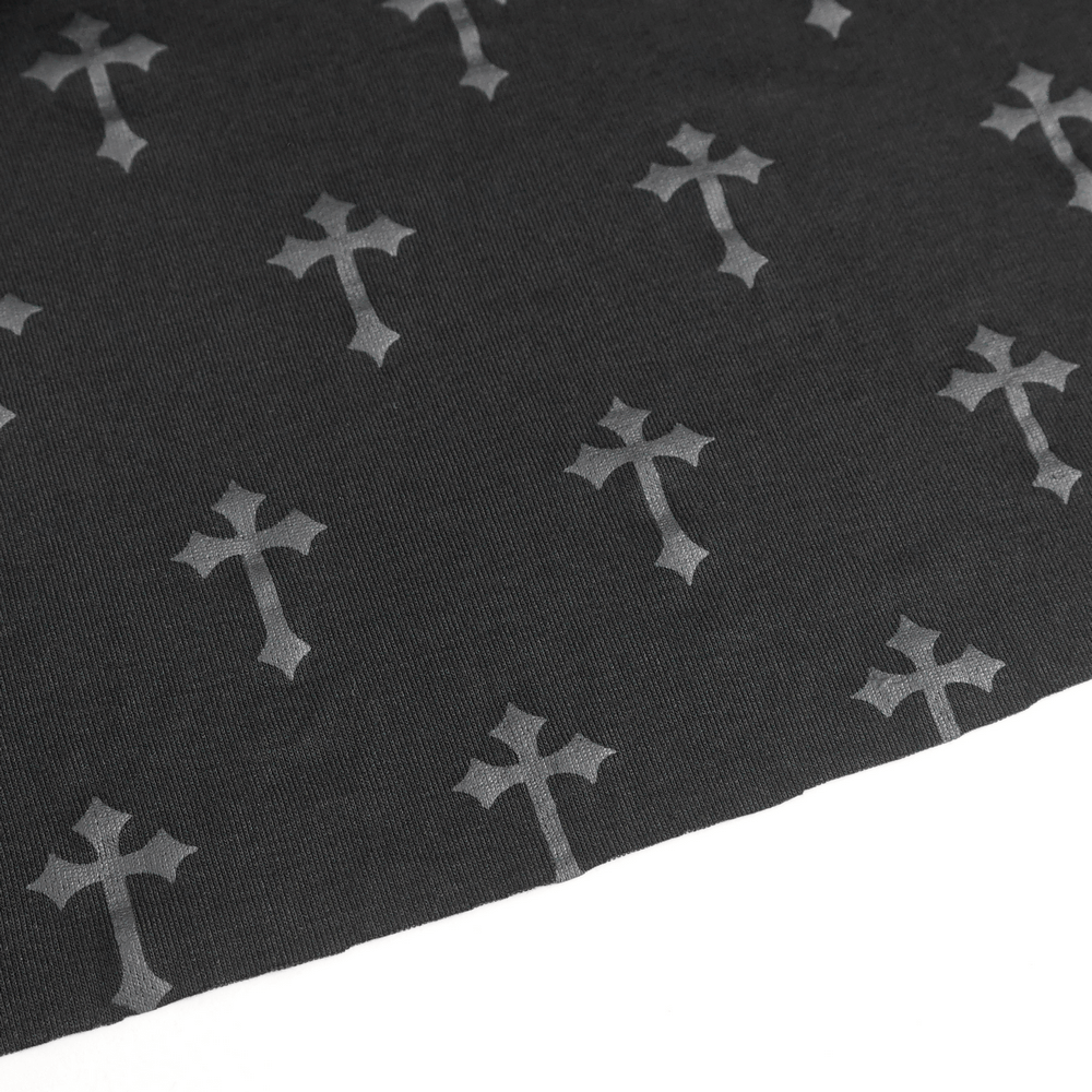 Close-up of black fabric featuring bold cross pattern, ideal for gothic fashion designs.