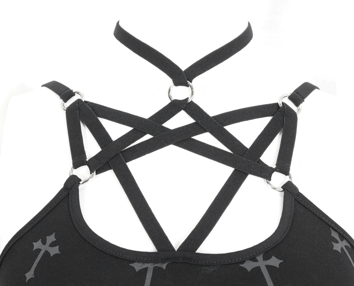 Close-up of black Gothic strappy top with intricate cross design and ring details.