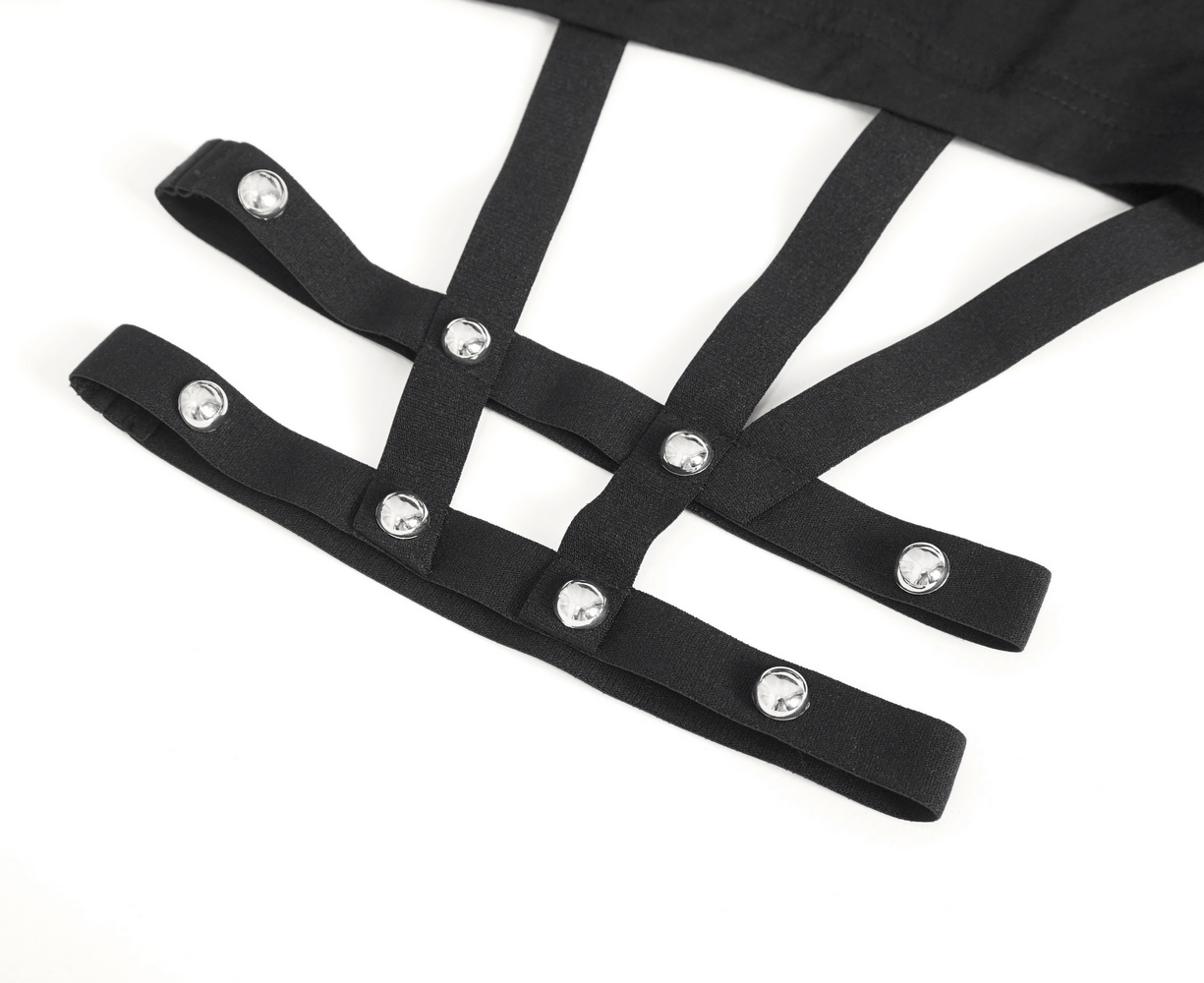 Close-up of black strappy detail with silver studs from a women's gothic maxi dress.