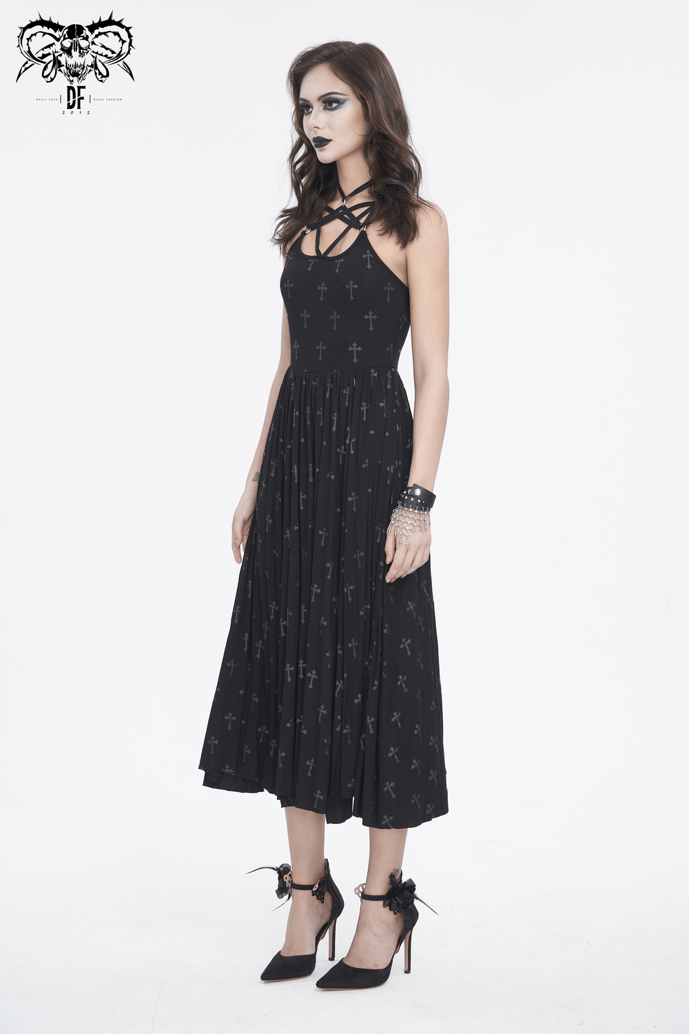 Women's Gothic black maxi dress with cross detail, fitted silhouette, and attached shorts for a dramatic look.