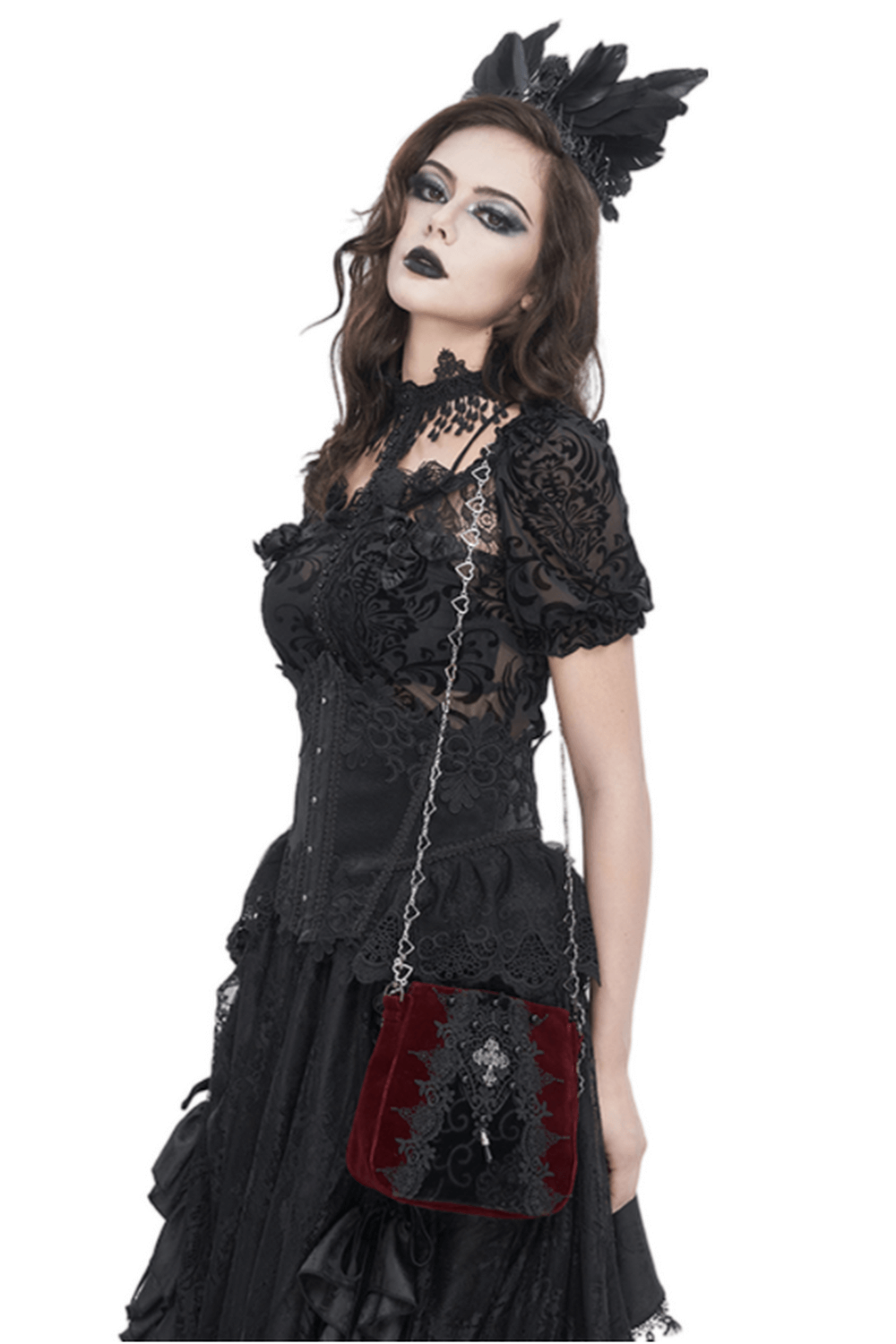 Model showcasing a luxurious women's gothic lace and velvet shoulder bag with intricate embroidery and silver chain accents.
