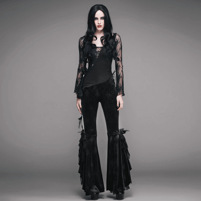 Elegant woman in black gothic flared trousers paired with a lace top, showcasing vintage flare and stylish gothic fashion.