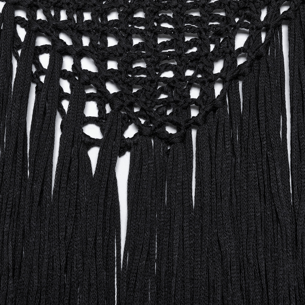 Close-up of black tassels and hollow-knit texture showcasing edgy design details of a gothic sweater.