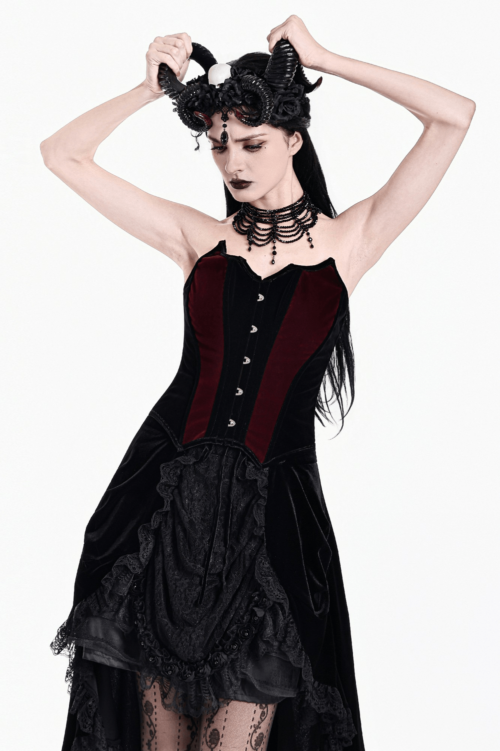 Women's Gothic Velvet Corset with Burgundy Panels worn with accessories and dramatic hairstyle.