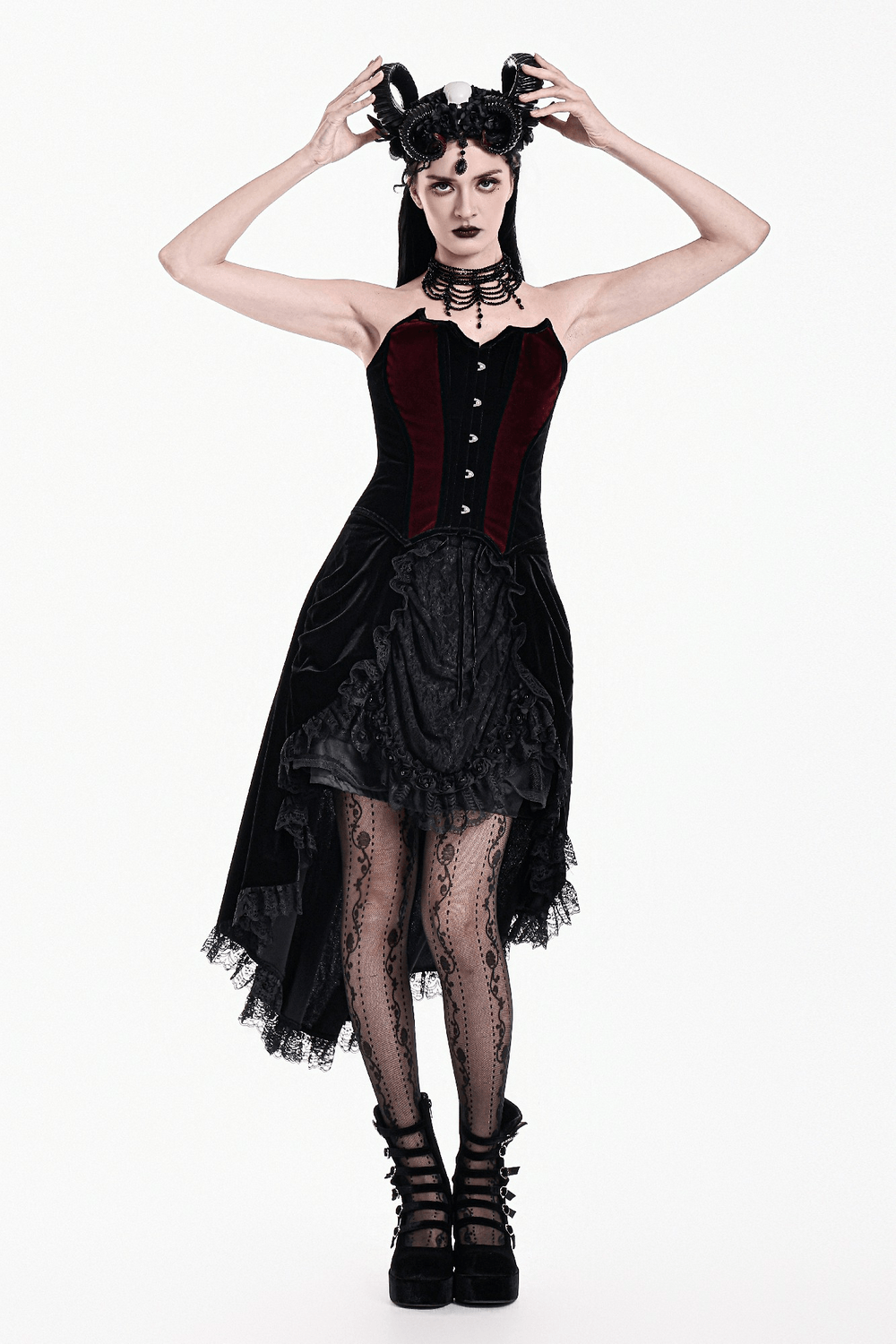 Model wearing Women's Gothic Velvet Corset with Burgundy Panels, showcasing lace details and dramatic silhouette.
