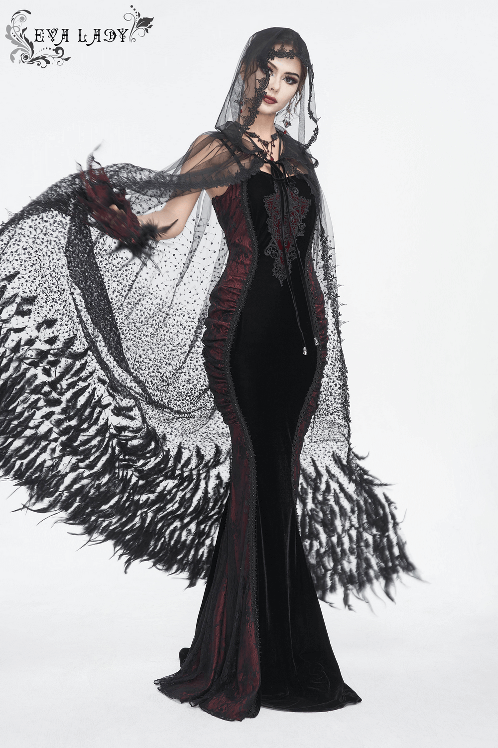 Elegant women's gothic velvet mermaid dress with lace appliques and veil, showcasing a dramatic silhouette.