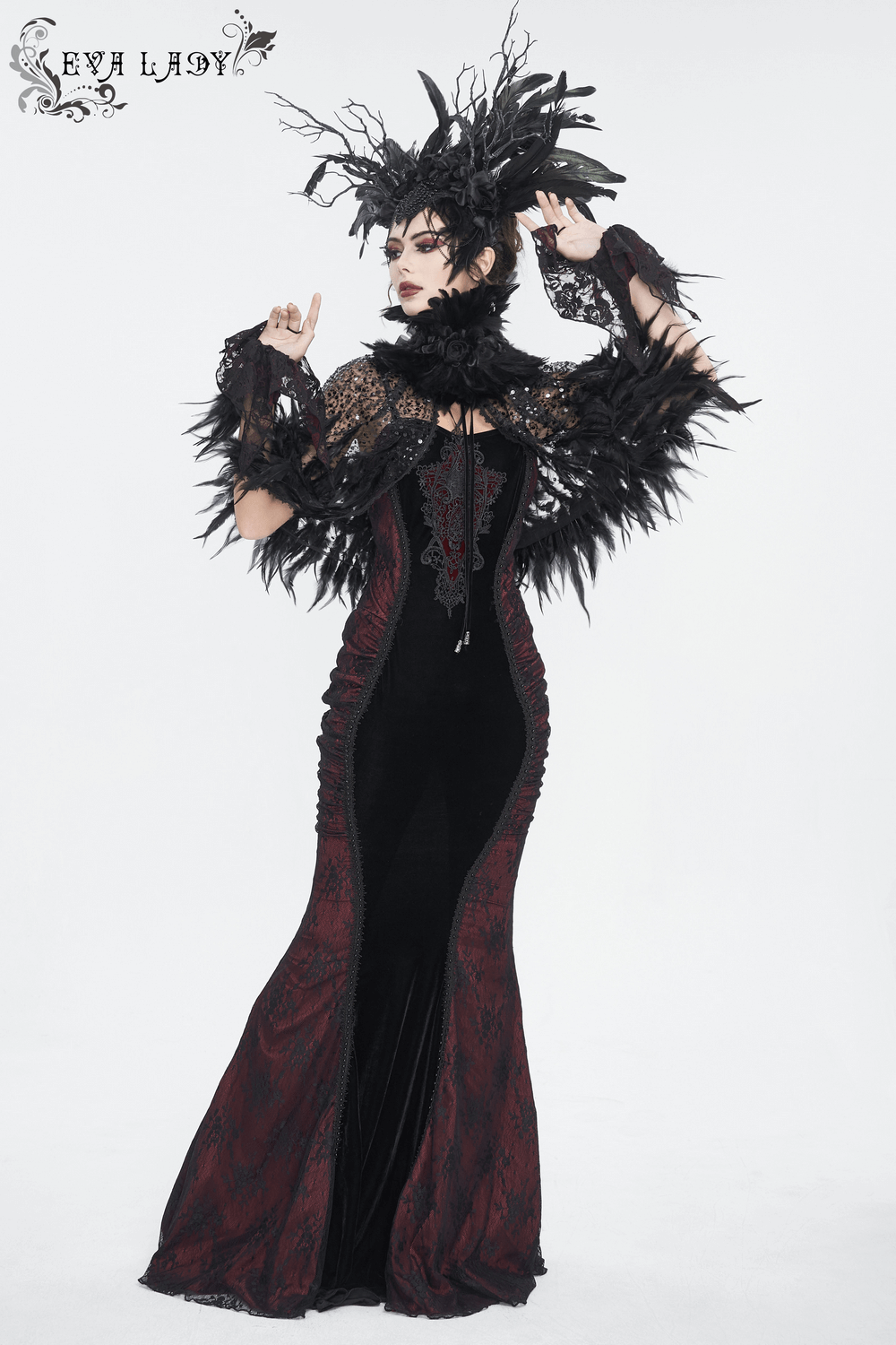 Gothic mermaid dress featuring velvet, lace appliques, and dramatic feather details, perfect for a romantic evening.