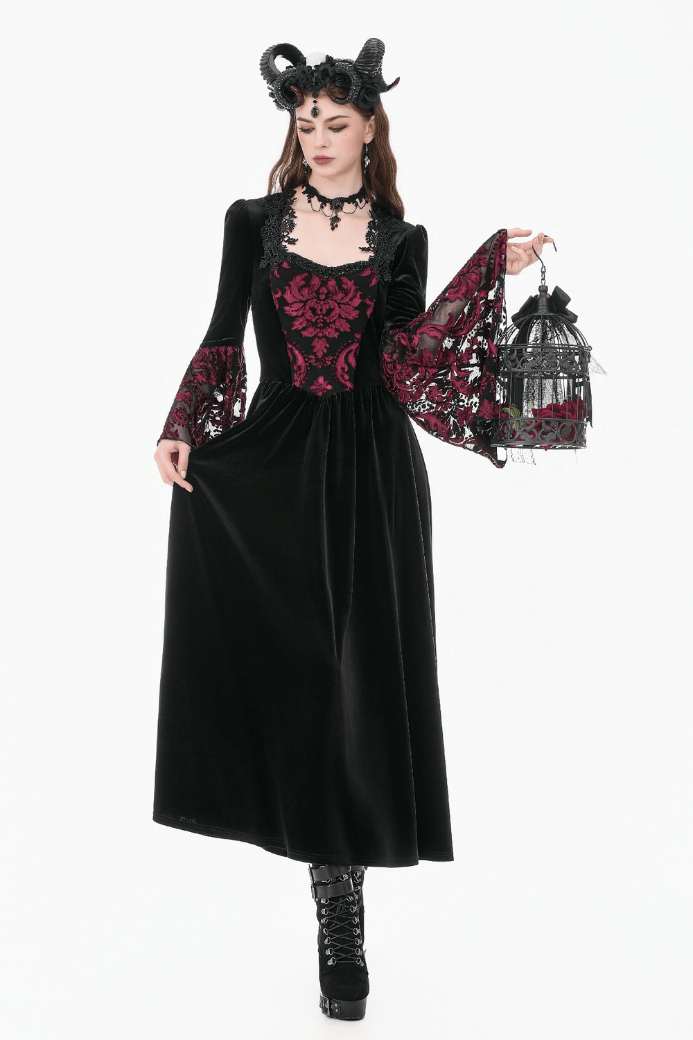 Women's Gothic Velvet Maxi Dress with Lace Bell Sleeves worn by model with horns, showcasing velvet and brocade details.