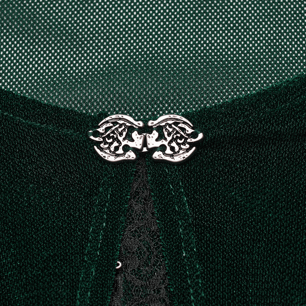 Close-up of hooks fastening on a women's green top, adding stylish detail to the chic design.