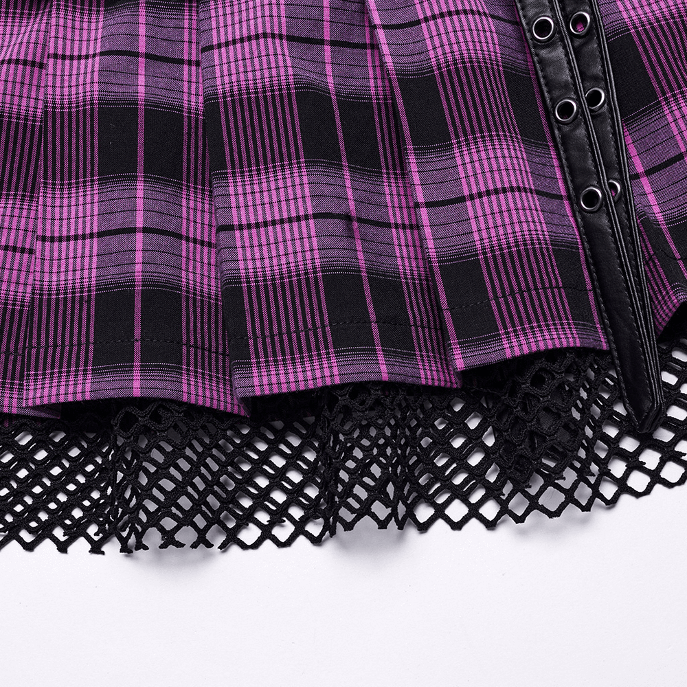 Close-up of a purple and black plaid pleated mini skirt featuring lace trim and faux leather accents.