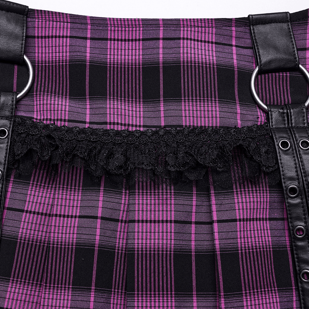 Close-up of a purple mesh pleated mini skirt featuring black lace trim and faux leather details with eyelets.