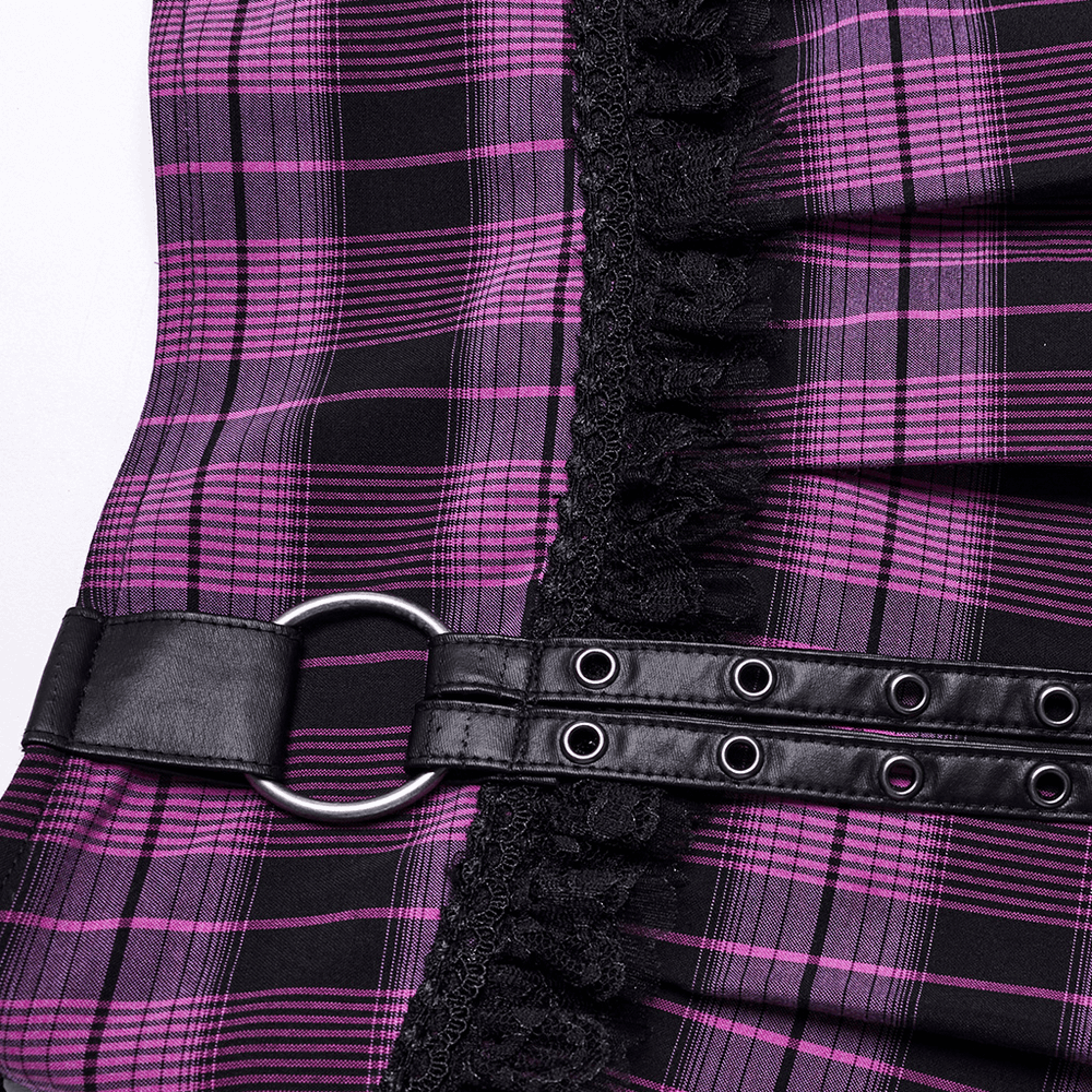 Close-up of a purple plaid mini skirt with lace trim and a faux leather belt detail, showcasing its edgy style.