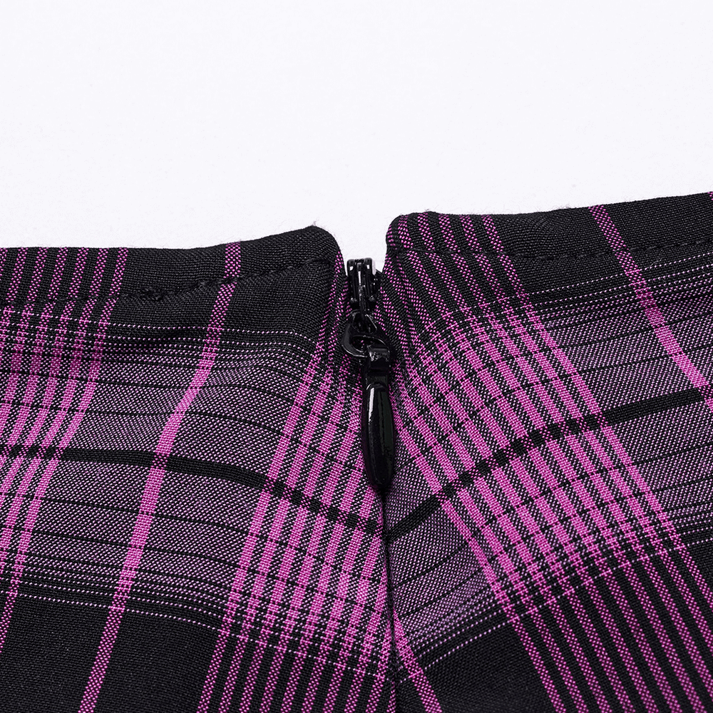 Close-up of the invisible side zipper on a women's purple plaid mesh pleated mini skirt with lace trim.