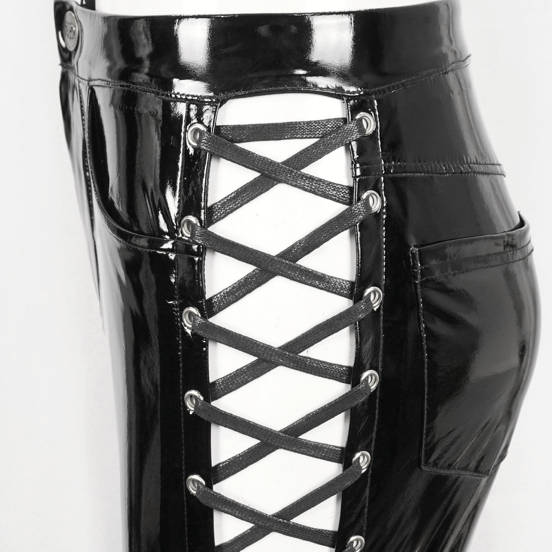 Close-up of women's hollow patent leather skinny pants with lace-up sides, showcasing edgy fashion details.