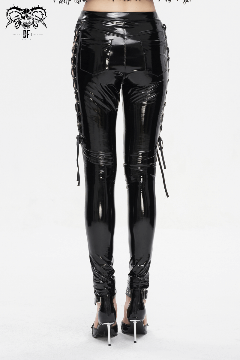 Back view of women's black patent leather skinny pants with lace-up sides, showcasing edgy elegance.