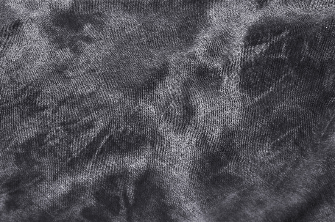 Close-up of dark, textured fabric showcasing a gothic punk aesthetic, perfect for edgy fashion statements.