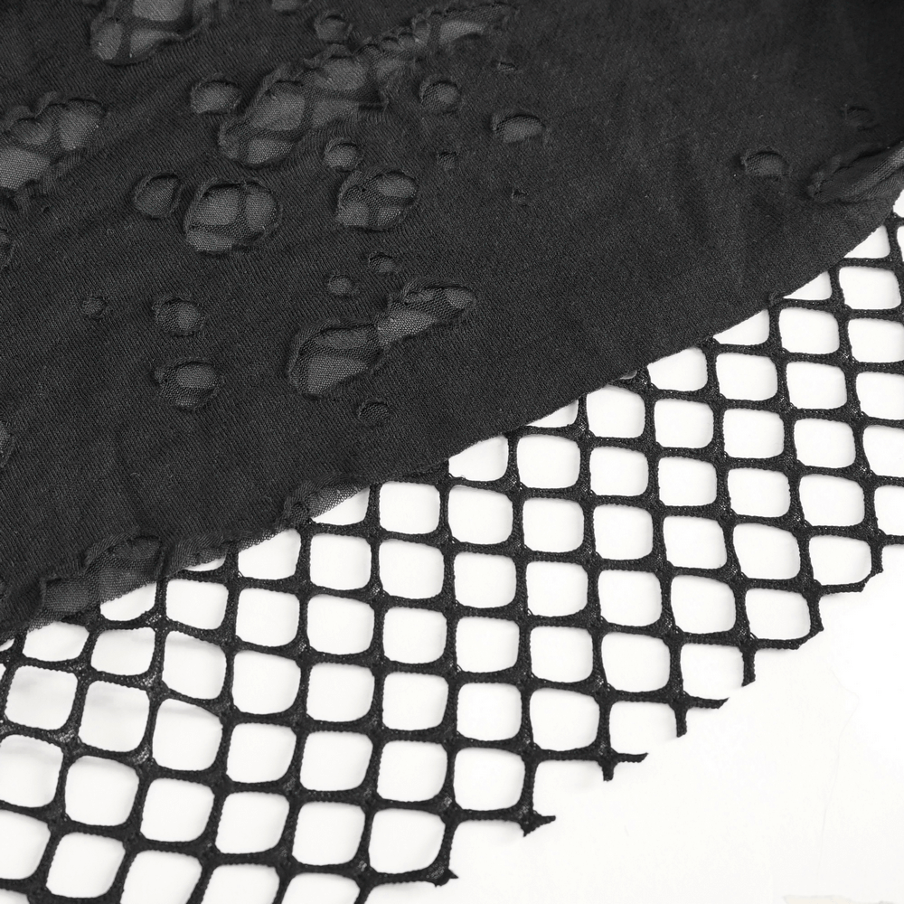 Close-up of black lace fabric featuring delicate holes and fishnet design, showcasing a modern edgy style.