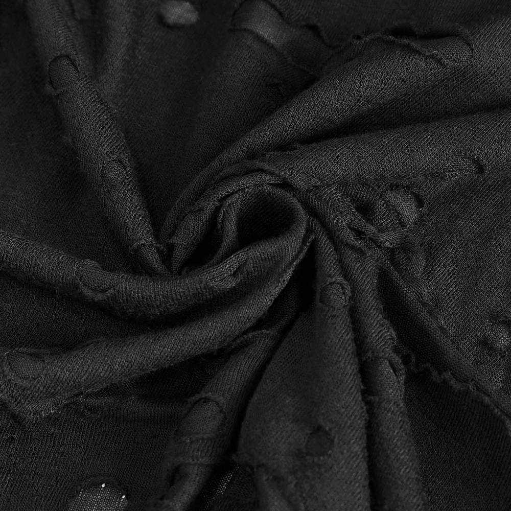 Close-up of black fabric featuring distressed holes, perfect for edgy fashion pieces.