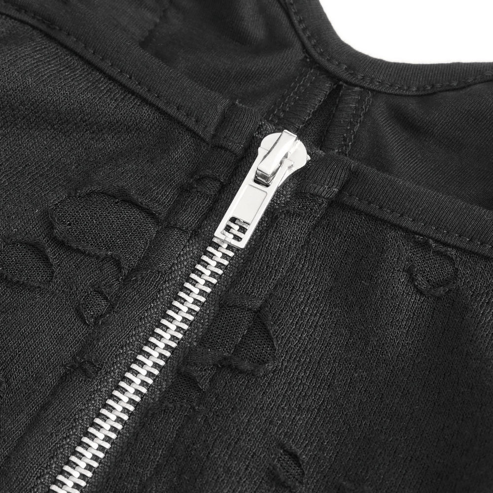 Close-up of a black lace dress zipper showcasing modern detailing and edgy style for evening wear.