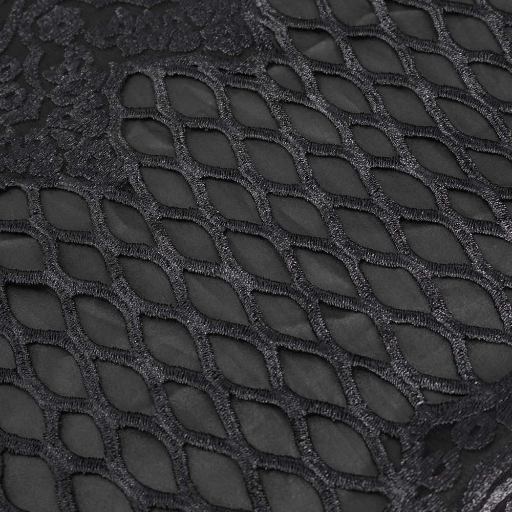 Close-up of intricate black lace fabric with unique textured pattern, perfect for elegant evening dresses.