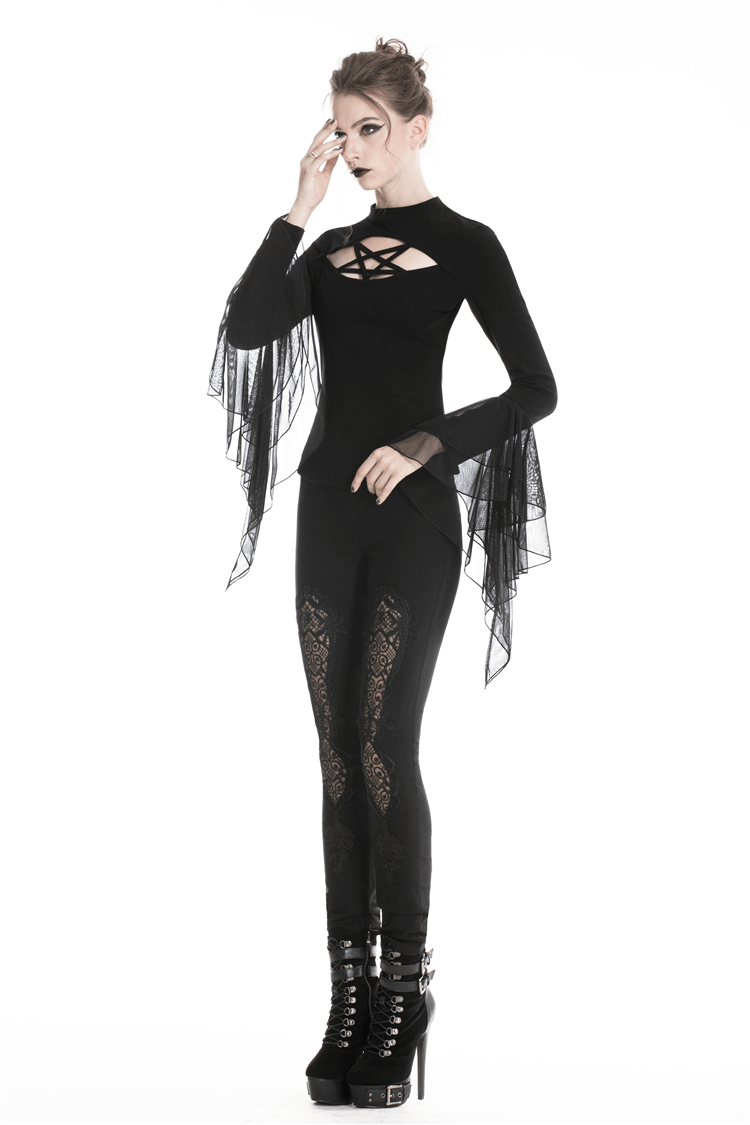 Elegant woman in black lace insert leggings and stylish top with tulle sleeves, showcasing a chic, edgy look.