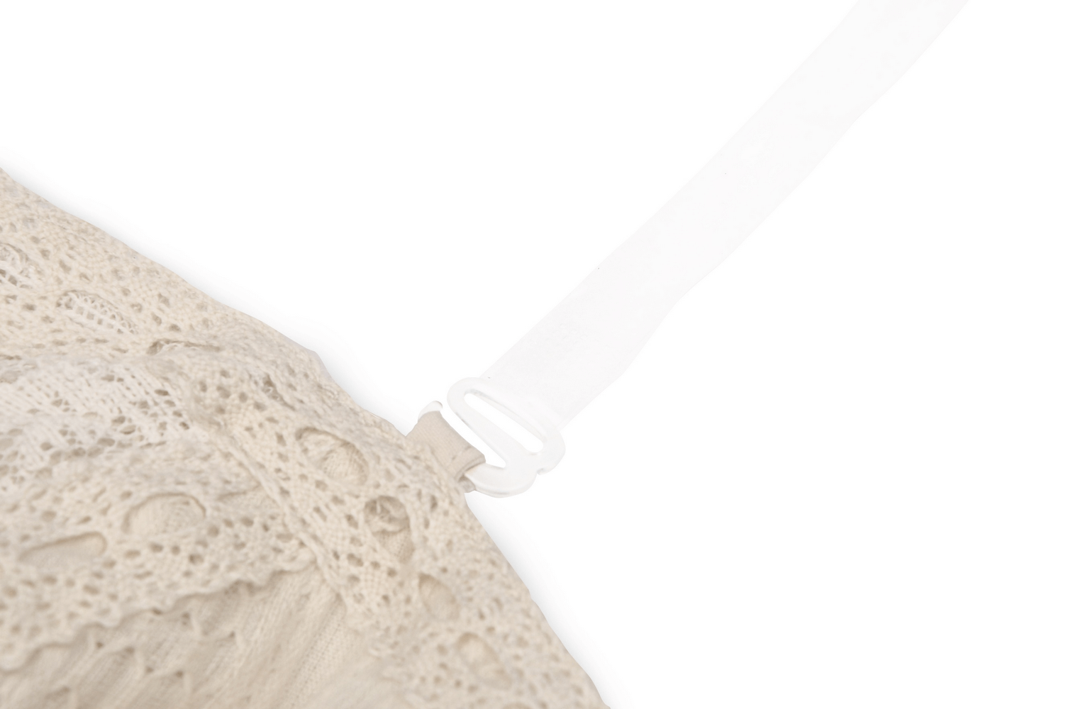 Close-up of elegant cream lace detailing and strap on a women's off-shoulder mini dress for gothic fashion.