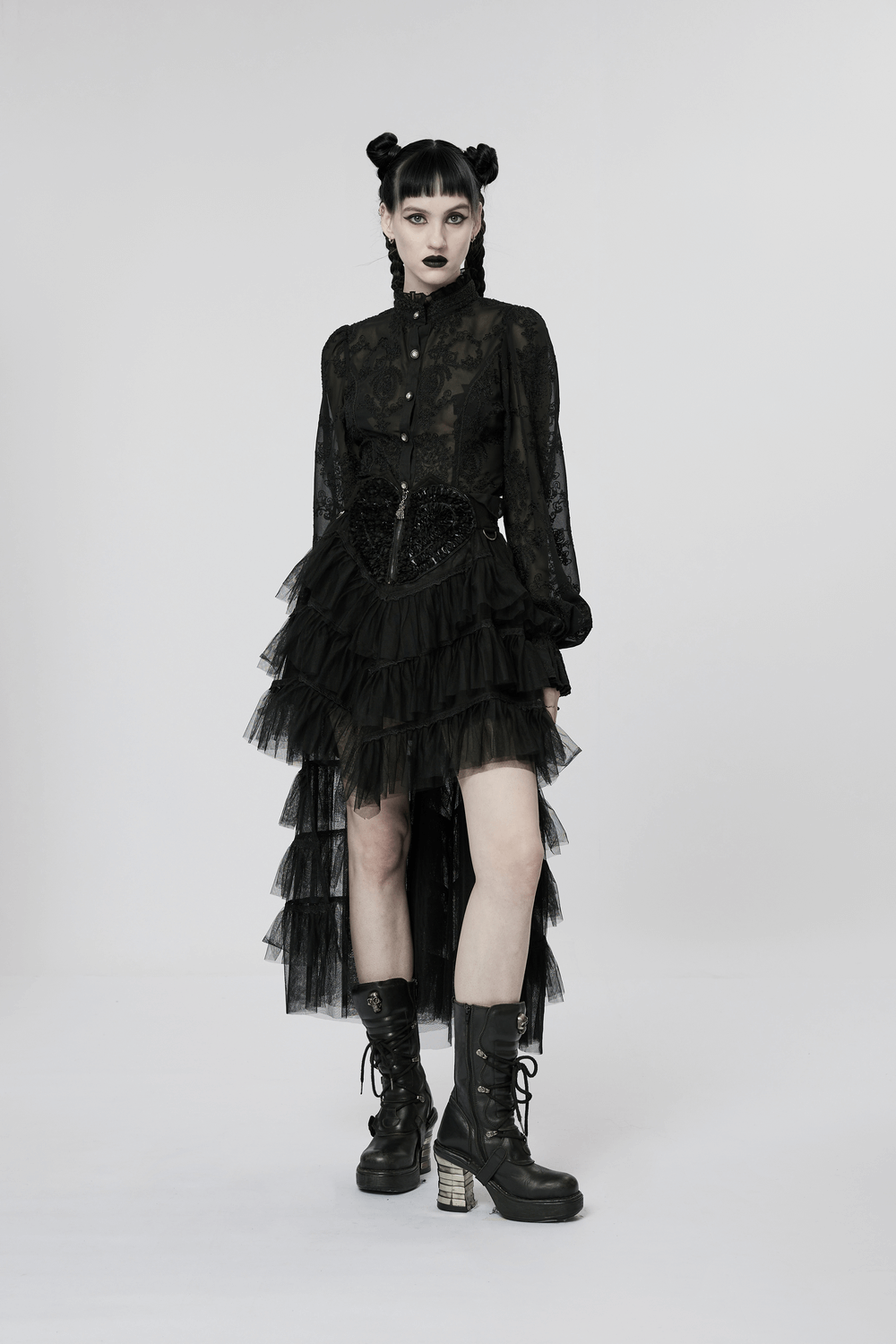 Stylish model in a Gothic lace ruffle blouse with flare sleeves, paired with a dramatic tiered skirt and combat boots.