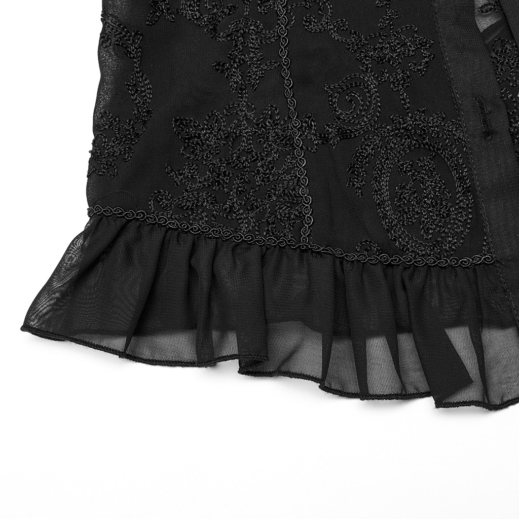 Close-up of black lace ruffle detailing on a Gothic chiffon blouse with embroidered patterns.