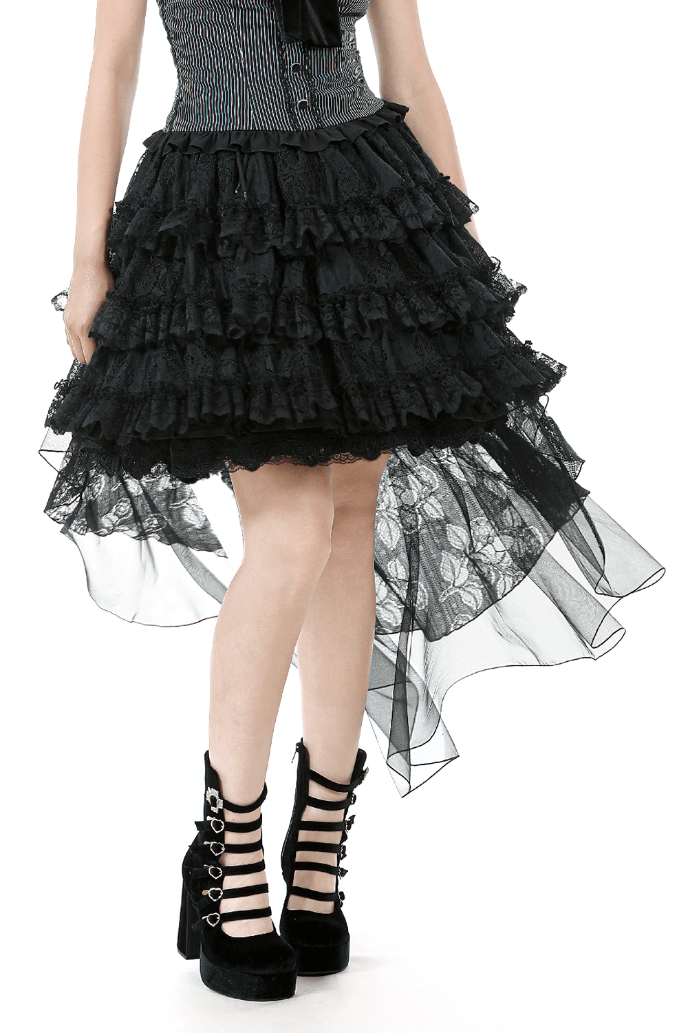 Women's gothic lace ruffled high-low skirt with sheer layers and edgy platform boots.