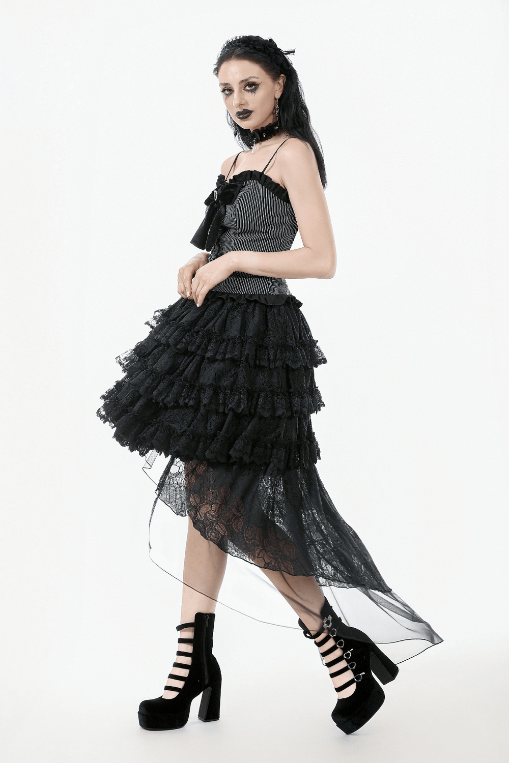 Gothic lace ruffled high-low skirt with sheer layers, styled over a black top, showcasing a vintage elegance.