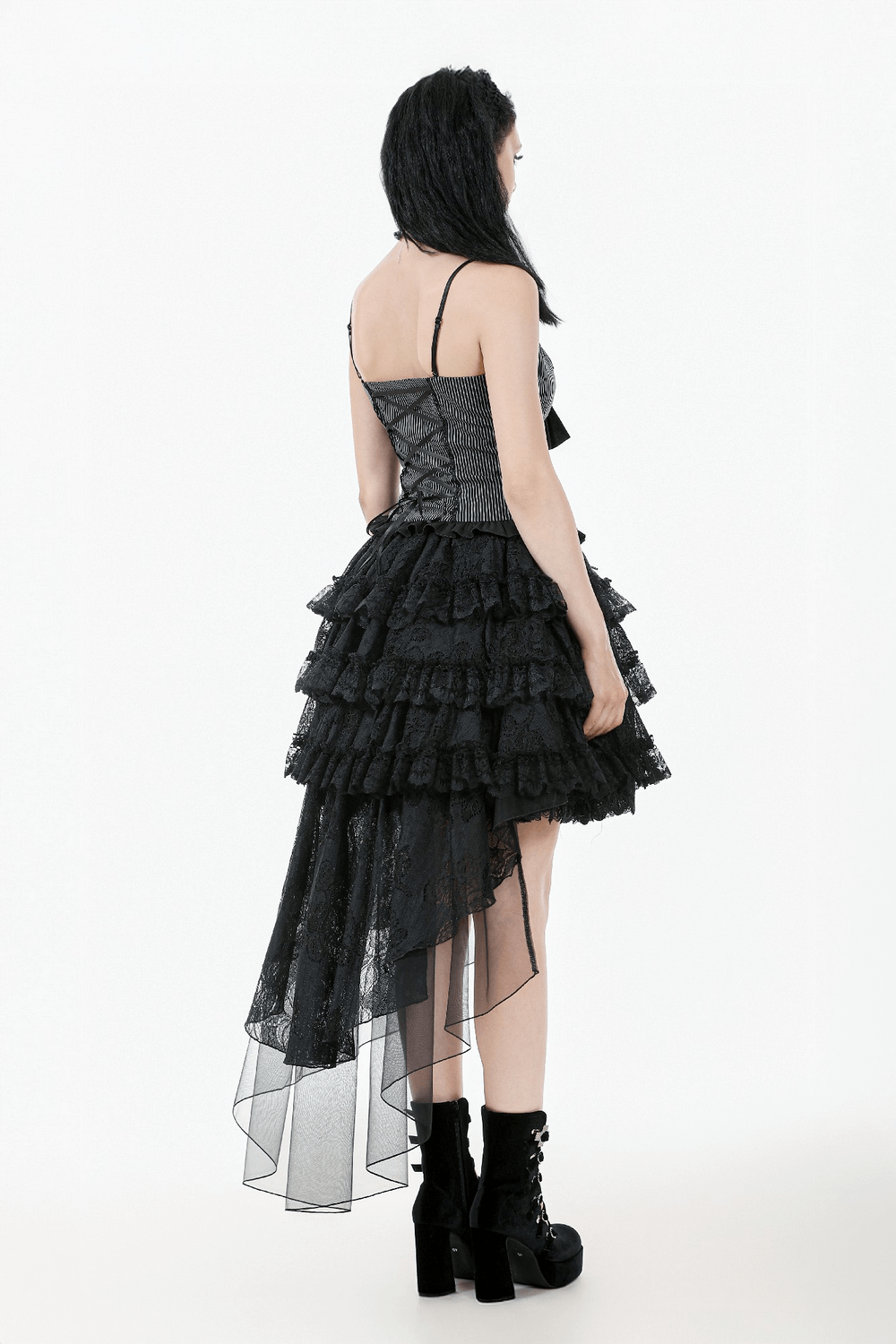 Back view of women's gothic lace ruffled high-low skirt with sheer layers, showcasing edgy vintage elegance.