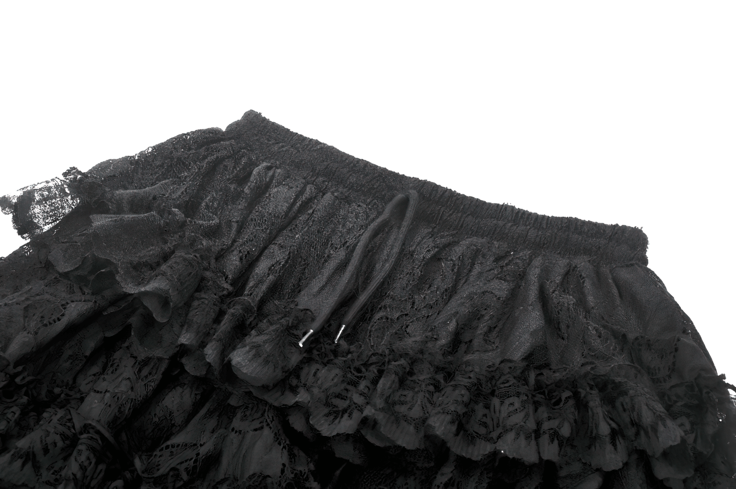 Close-up of a black lace ruffled high-low skirt showcasing intricate detailing and sheer layers.