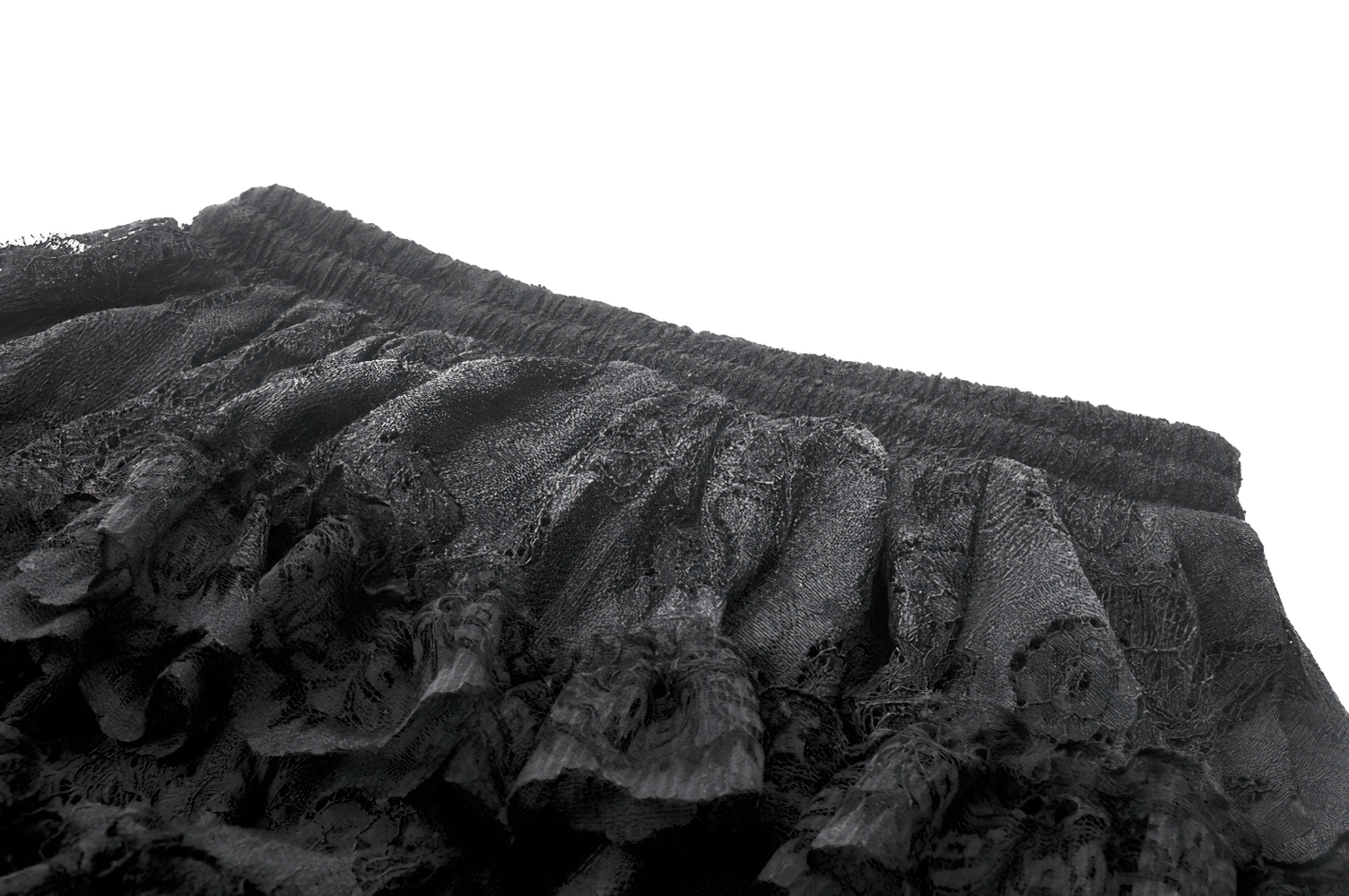 Close-up of a black lace ruffled high-low skirt showcasing intricate details and elastic waistband.