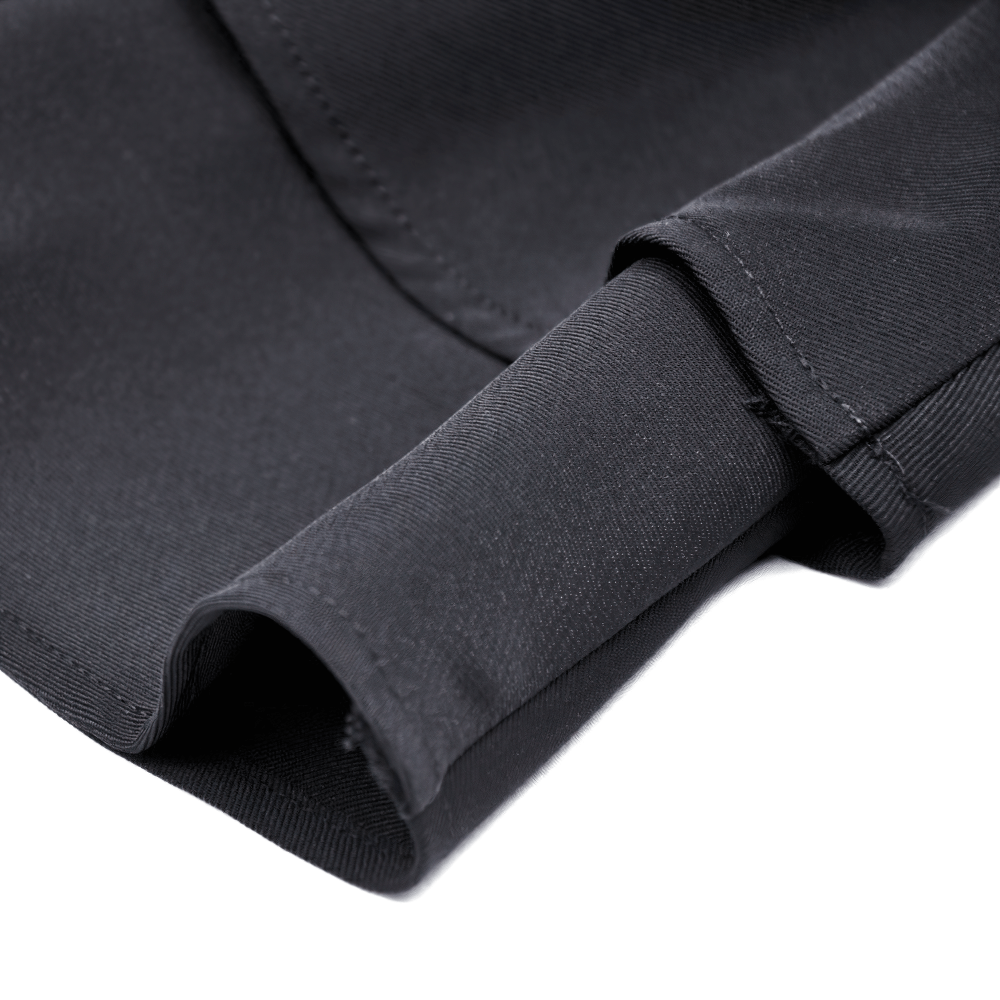 Close-up of luxurious black fabric showcasing the smooth texture of a stylish garment cuff.