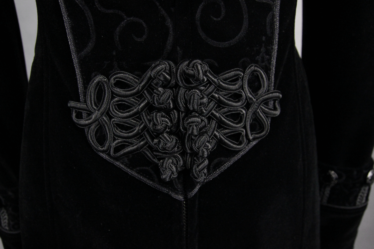 Close-up of vintage gothic women's long black coat with intricate back detailing and elegant knot design.