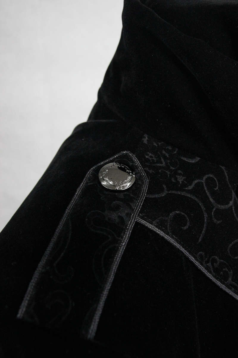 Close-up of women’s gothic long black coat featuring intricate jacquard detailing and stylish button.