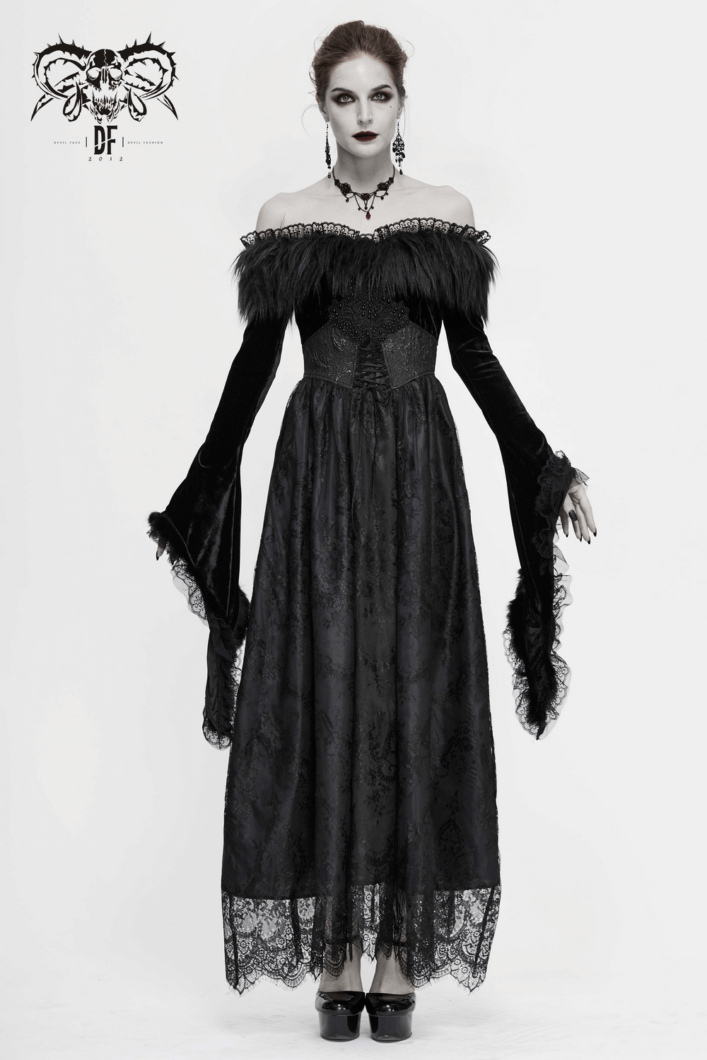 Gothic women's long black velvet dress with flare sleeves and fur inserts, perfect for a vintage-inspired look.