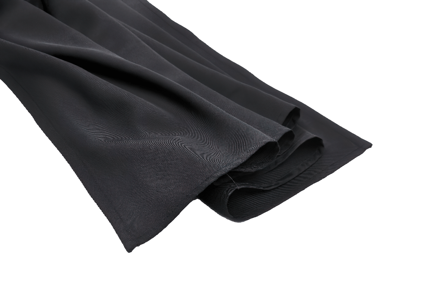 Close-up of sleek black fabric, showcasing the luxurious texture and drape perfect for gothic-inspired fashion.