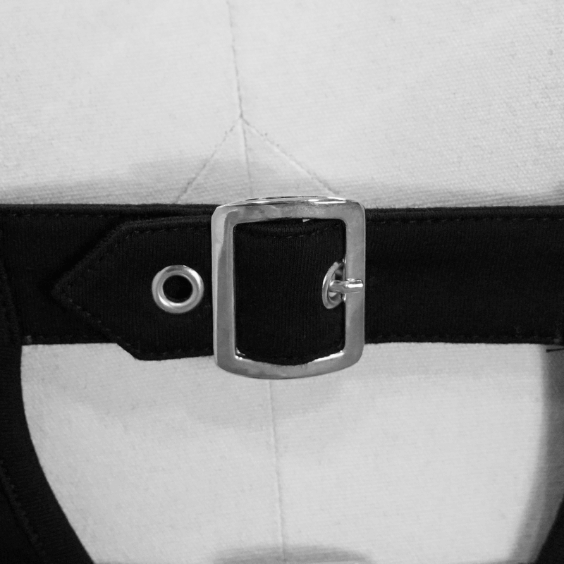 Close-up of a silver buckle on a black strap of a punk gothic crop top for stylish detailing.