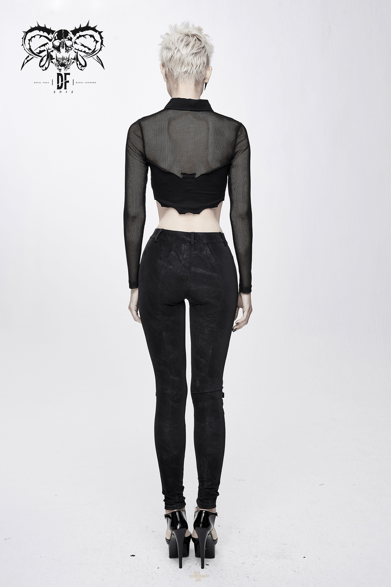 Back view of a model wearing a punk gothic black mesh crop top paired with black skinny jeans.