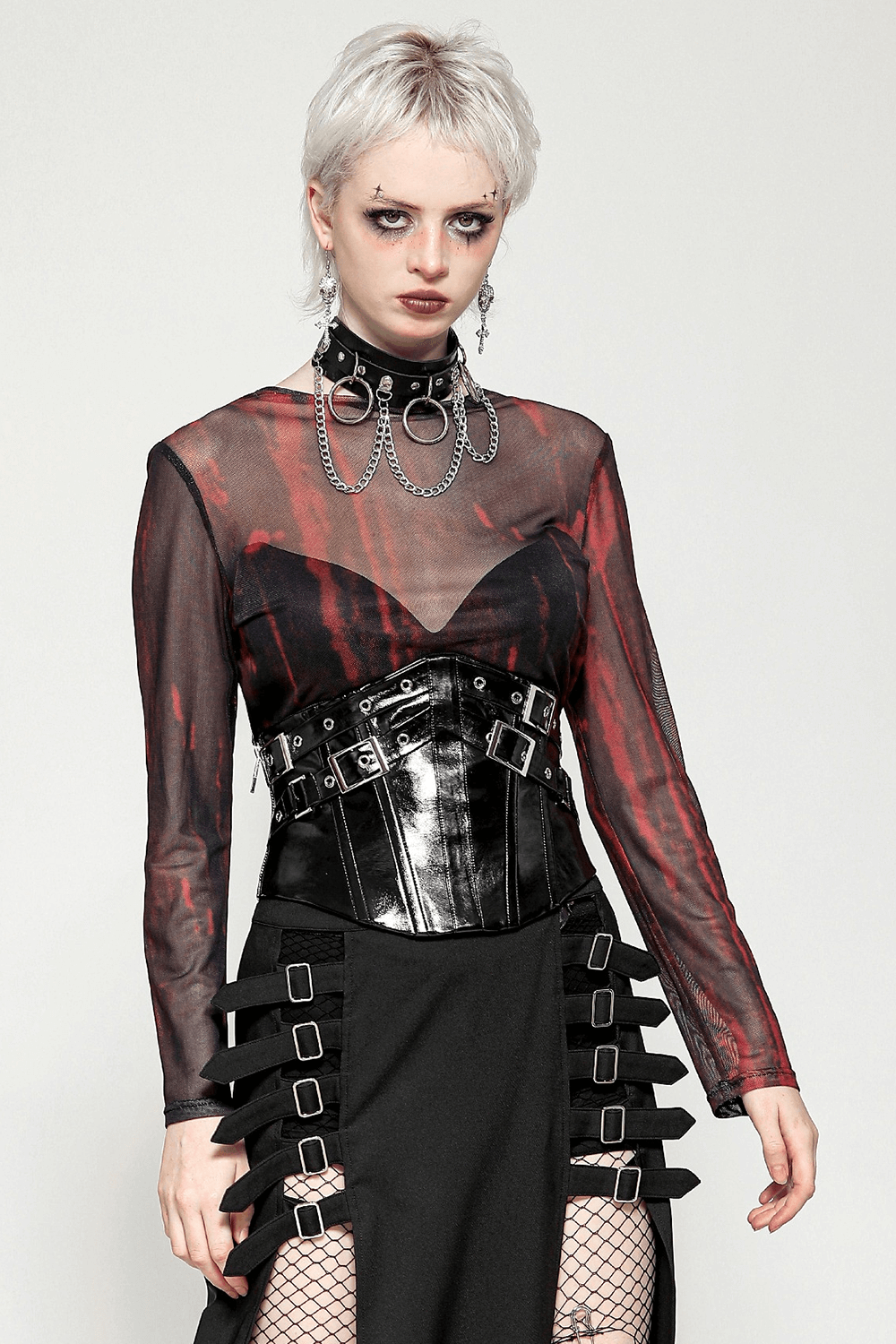 Edgy women's long sleeve sheer mesh top in bold red and black pattern, layered cyberpunk aesthetic.