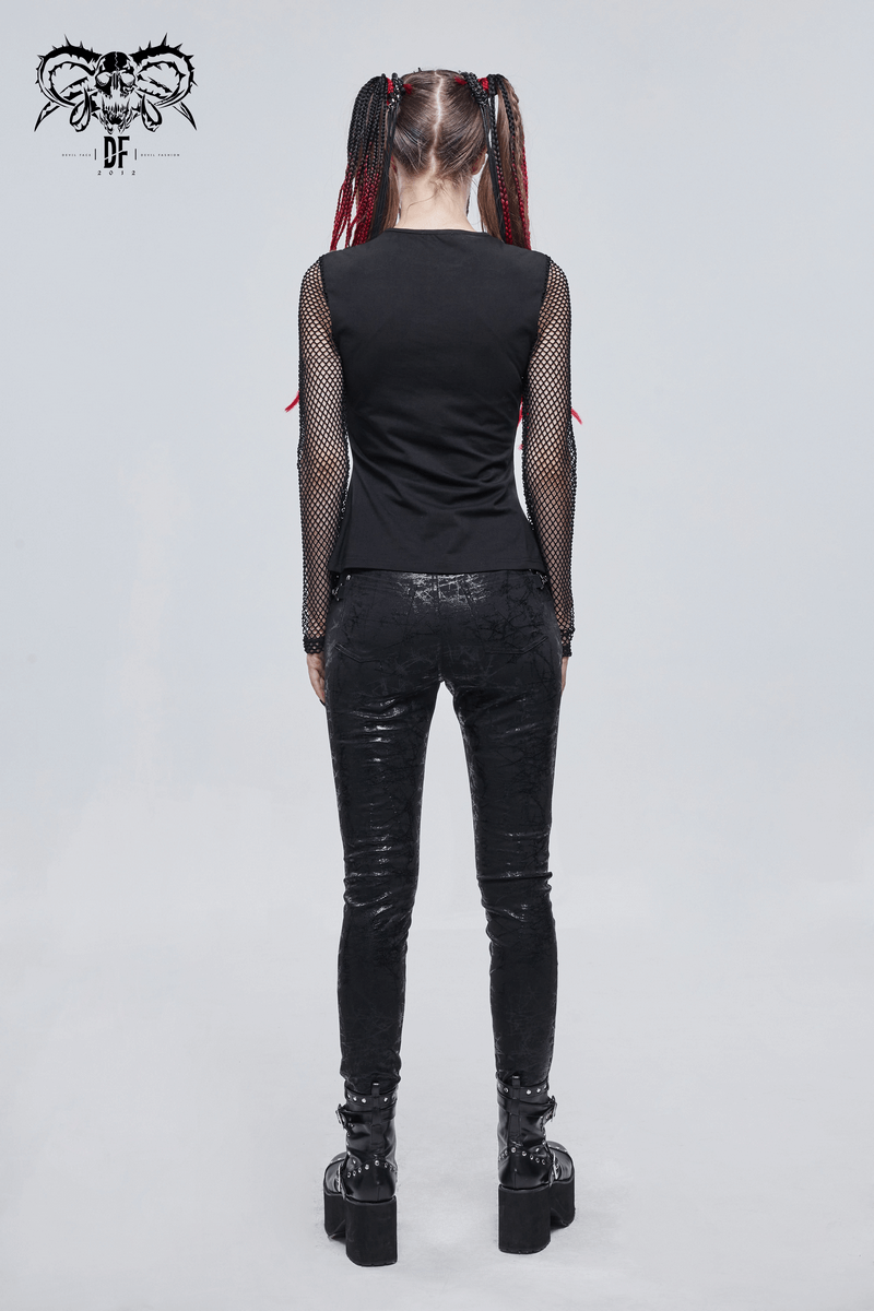 Back view of a woman in a black mesh long sleeves top and shiny black pants, showcasing gothic style fashion.
